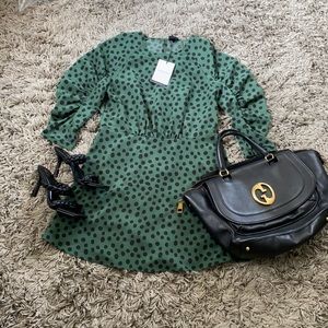 Green and black women’s dress